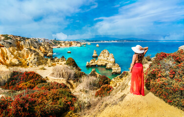 Landscape with unknown tourist girl is looking to the amazing view of spectacular rock formations,...