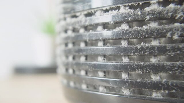 Close up on a dusty home air vent. 4K
