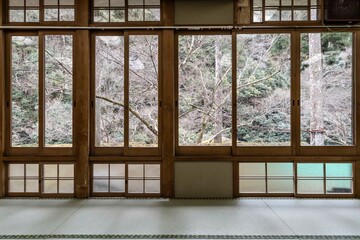 Japanese-style wooden windows looking out over the natural trees