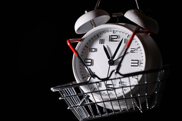 Red shopping basket with white retro alarm clock in it. Lose time. Buy time. Break. Motivation....