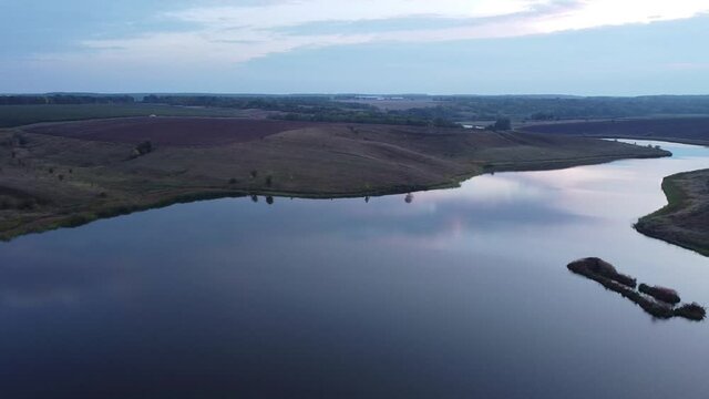 Drone flight over the mouth of the river, natural beauty, evening photography of the river