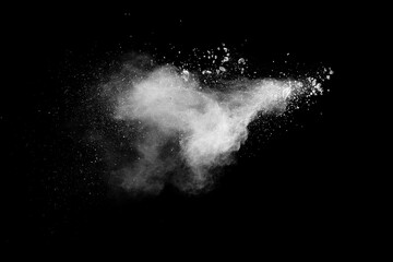 Fototapeta na wymiar White powder explosion clouds.Freeze motion of white dust particles splash on black background.