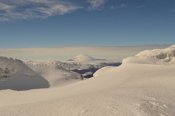 Fototapeta na wymiar Mountain climbing during the sunrise on the snow covered active Volcan Villarrica in Pucon, Chile