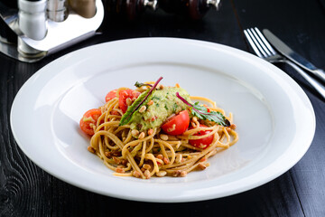 spaghetti with mashed potatoes and pine nuts