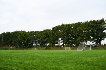 Empty football field on cloudy day