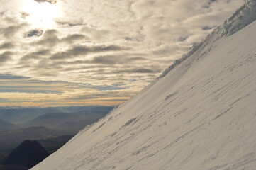Mountain climbing during the sunrise on the snow covered active Volcan Villarrica in Pucon, Chile