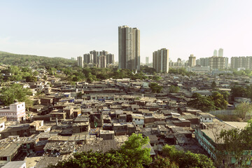 Skyscrapers and slums in a suburb in the city of Mumbai
