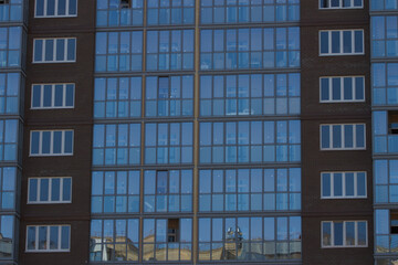 Obraz premium Windows of multi - storey buildings