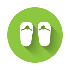 White Flip flops icon isolated with long shadow. Beach slippers sign. Green circle button. Vector.