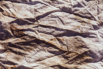 Dirty old crumpled fabric as an abstract background.