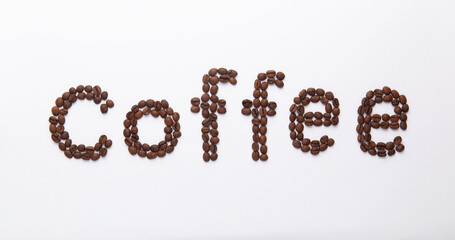 word coffee lined with coffee beans