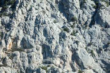 Stone rock in the mountains as an abstract background.