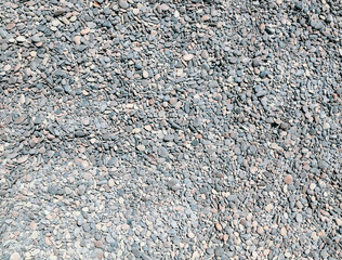 Stone pebbles on the sea as an abstract background.