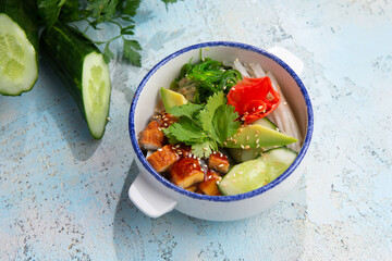 eel tartare with avacado and herbs in a plate