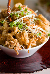 Calamari served with spicy and sweet dipping sauces. Classic American restaurant or French bistro appetizer favorite. Fresh octopus, squid and shrimp battered and deed fried.