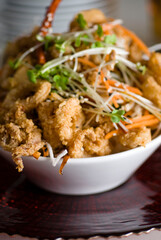 Calamari served with spicy and sweet dipping sauces. Classic American restaurant or French bistro appetizer favorite. Fresh octopus, squid and shrimp battered and deed fried.