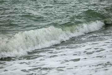 Wave in the sea with splashing water.