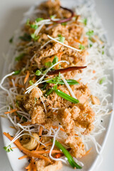 Calamari served with spicy and sweet dipping sauces. Classic American restaurant or French bistro appetizer favorite. Fresh octopus, squid and shrimp battered and deed fried.