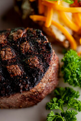 Steak. Grass-fed skirt steak, grilled to a medium rare and served with a garlic herb butter sauce and paired with roasted potatoes and Brussels sprouts. Classic American steakhouse favorite.