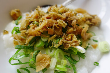 Rice porridge topping. Slice of chicken meat and fresh spring onion