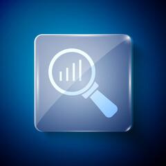 White Magnifying glass and data analysis icon isolated on blue background. Square glass panels. Vector.