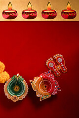 happy diwali or happy deepavali greeting card made using a photograph of diya or oil lamp