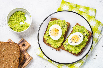 Avocado Sandwiches on white background.