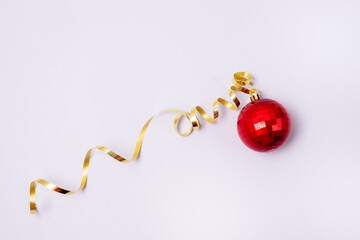 Christmas or New Year Card or Background Red Christmas Ball and Golden Thread Blue Background Top View