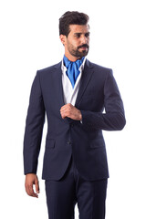 A young man wearing a black suit on a white background