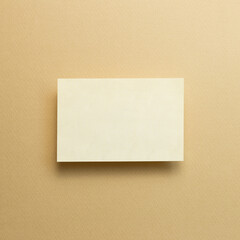 Blank memo pad, empty paper on beige background. top view, copy space