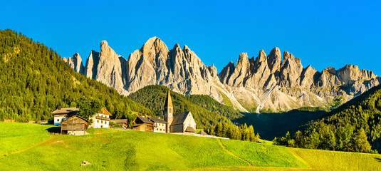 View of Val di Funes with the Chruch of Santa Maddalena in the Dolomites Mountains. UNESCO world...