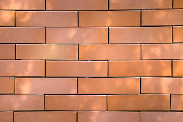 Fototapeta premium Wall background close-up, red stone background