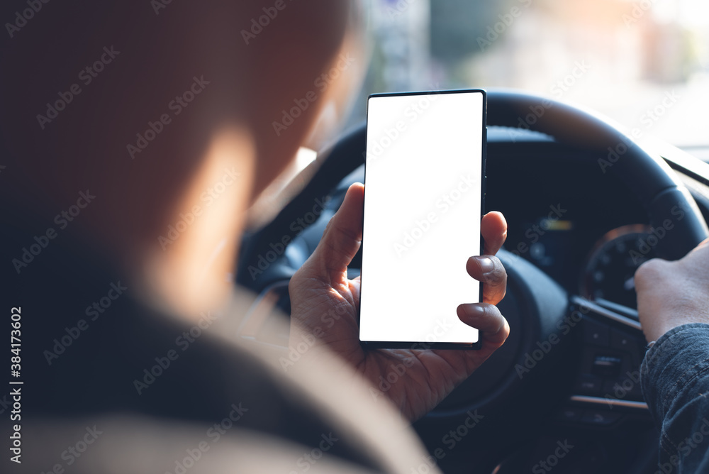 Poster mockup of man using blank screen mobile smartphone searching location while driving a car