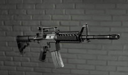American army rifle M4A1 against a brick wall