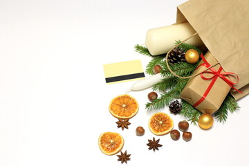 Christmas shopping concept, package with groceries, champagne and gifts on white background
