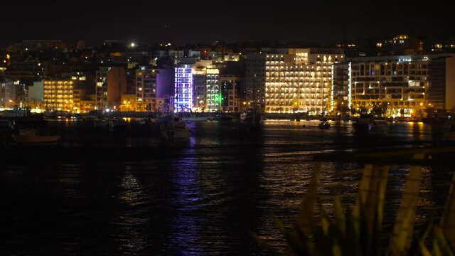 Rush hour ferry tourist ride at Sliema bay Malta timelapse