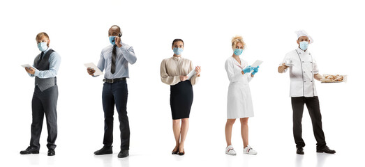 Obraz premium Group of people with different professions on white studio background, horizontal. Modern workers of diverse occupations, male and female models like accountant, cosmetologist, baker in face masks