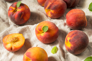 Fototapeta na wymiar Raw Orange Organic Peaches