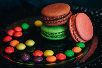 colorful macaroons on wooden background
