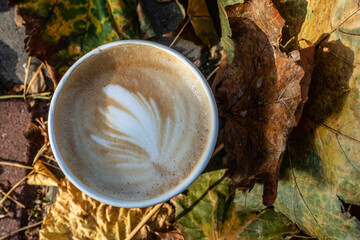 coffee cup and autumn leaves