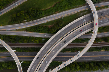 This is an aerial view of the three-level interchange between Interstate 64 and US Route 119 in Charleston, West Virginia. The exit crosses over a pair of railroad tracks and MacCorkle Avenue. - 384181446