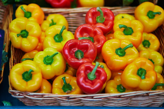 Large heap of fresh ripe organic bell peppers on farmer market in Paris