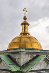 Fototapeta na wymiar Dome with a cross of St. Isaac's Cathedral in St. Petersburg, Russia