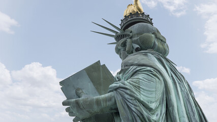 Dramatic close up view of the back of the Statue of Liberty in New York City. © Wollwerth Imagery