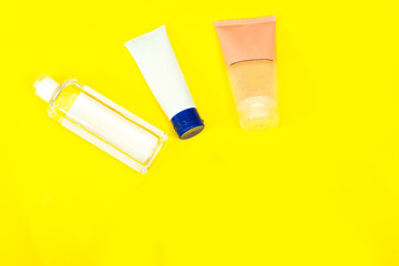Makeup remove skin care and Beauty cosmetics  tube; branding mock up isolated on yellow background. Package for hand cream or scrub. Beauty cosmetics tube, branding mock up