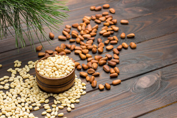 Obraz na płótnie Canvas Pine nut kernels in wooden box. Pine nuts on table.