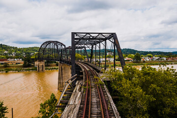 This is a wide view of an abandoned railroad bridge that carried the Chesapeake & Ohio Railroad and CSX Transportation over the Kanawha River in Charleston, West Virginia.