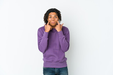 Young african american rasta man crying, unhappy with something, agony and confusion concept.