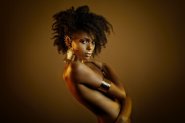 Colorful portrait of a beautiful afro girl wearing gold jewelry