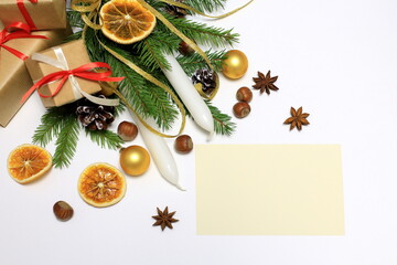 happy new year. Christmas concept. composition with spruce paws, candles and gifts on a white background, horizontal position with space for text